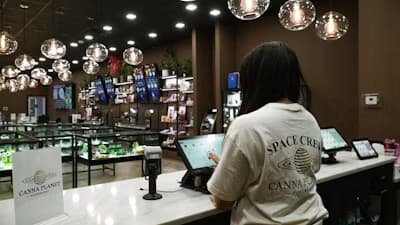 Photo of a customer using a tablet POS at a retail counter